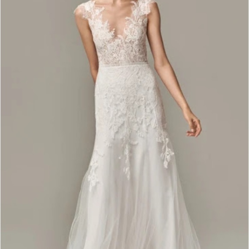 This is a never worn wedding dress. Size 4 but fits like a size two.